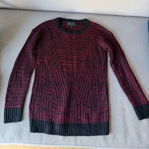 warm maroon and black sweater